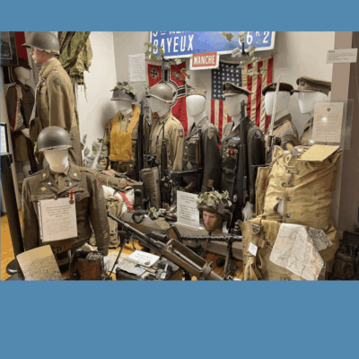 A display of military uniforms in a museum, showcasing the rich history and legacy of various branches and regiments through their meticulously preserved attire.