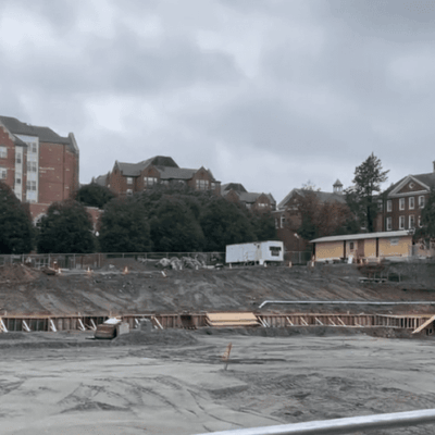 A nursing station at a construction site, with a building in the background.