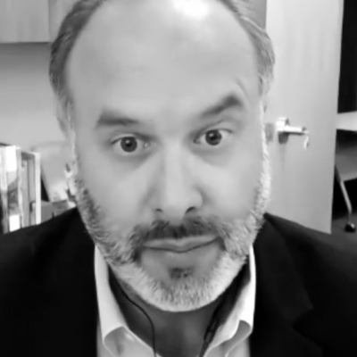 A black and white photo of a homeless man with a beard in RI.