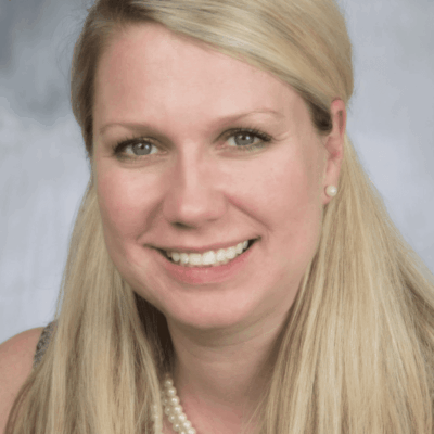 Kerry LaPlante, a woman with long blonde hair, smiling for the camera.