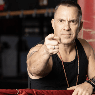 A man in a boxing ring pointing his finger.