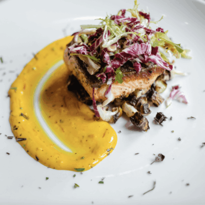 A plate of food with a delicious sauce on it that pairs perfectly with various recipes.