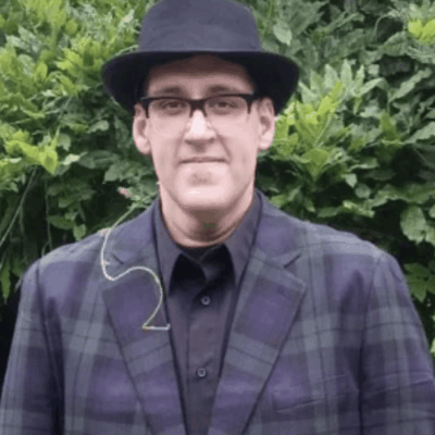 Tony Jones, a man in a plaid jacket and hat.