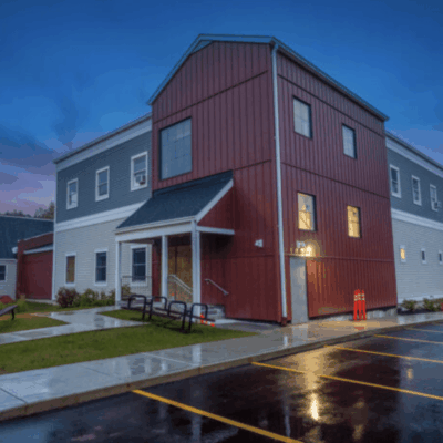 The exterior of the Wood River Health Services building at dusk.