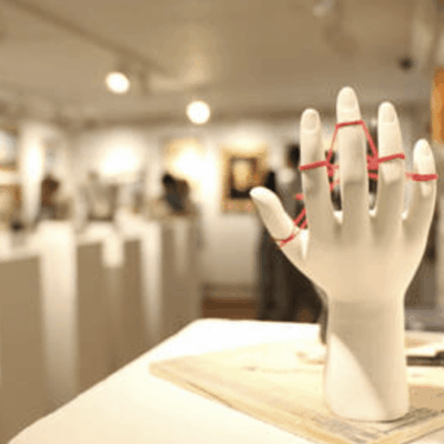 A mannequin hand on display in an art gallery, showcasing the intricate craftsmanship and attention to detail.
