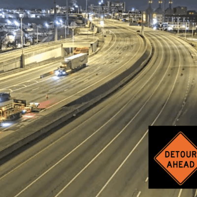 Detour ahead signs on Route 195 at night.