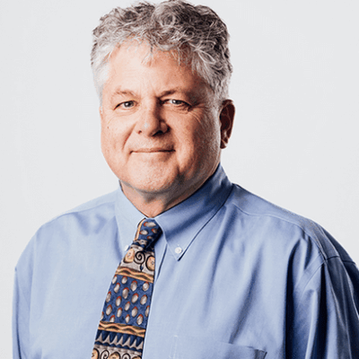 A man wearing a blue shirt and tie, dedicated to save the bay.