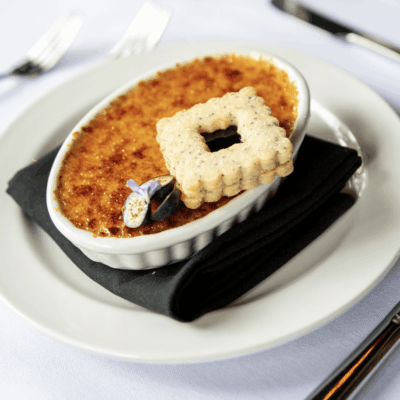 A recipes dessert on a plate with a fork and knife.