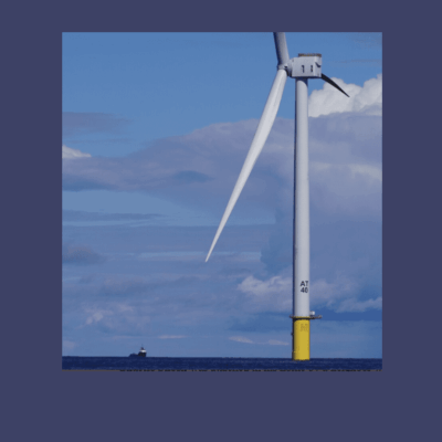 An image of wind turbines in the ocean.