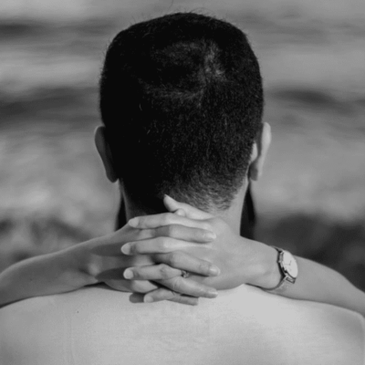 A black and white photo of Dr. Michael Fine holding his son's hand.