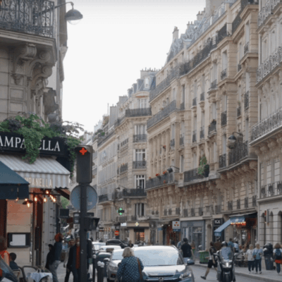 A street in Paris showcasing traditional architecture.