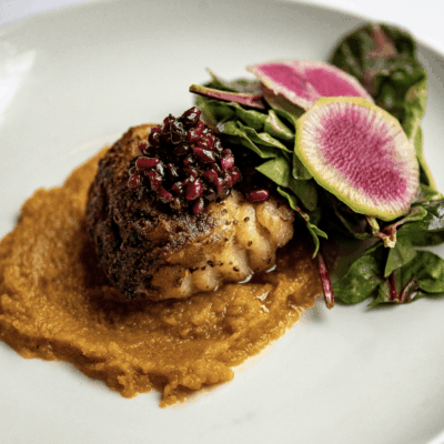 A plate of food with recipes on a white plate.