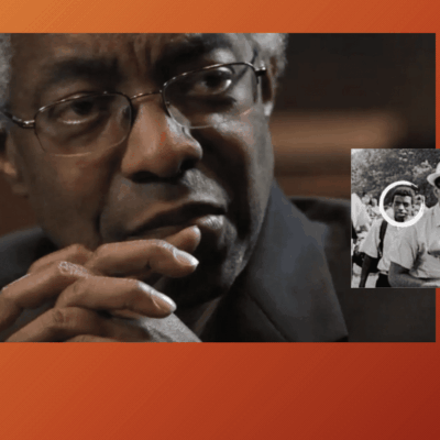 An image of Ray Rickman with glasses and an orange background.