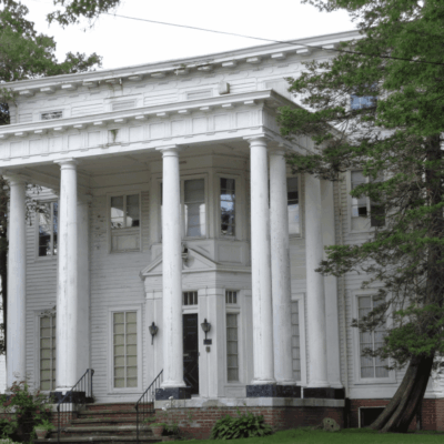 A large white house with columns and pillars in Pawtucket.