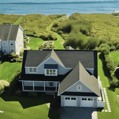 An aerial view of a Rhode Island home near the ocean.