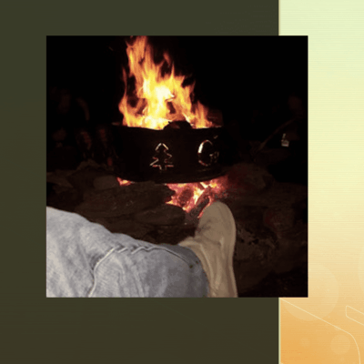 A person's feet in front of a fire pit with Michael Morse.