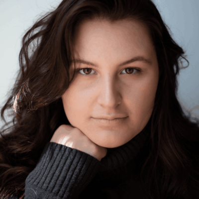 A woman wearing a black sweater.