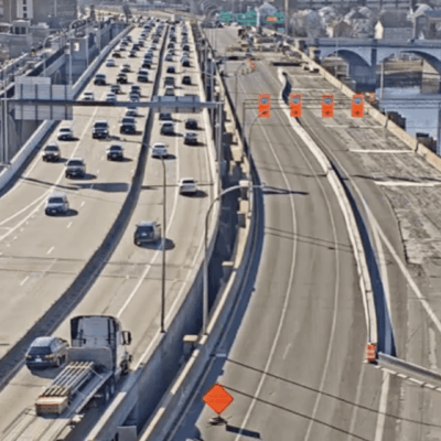Highway bridge under construction, traffic.