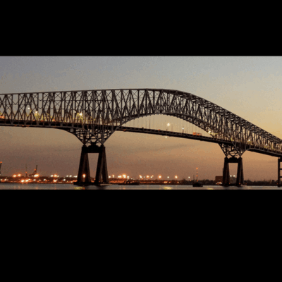 Here's an alt tag for the image: Sunset view of the long bridge.