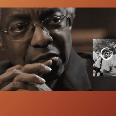 Here's an alt tag for the image: Black man reflecting on civil rights history.