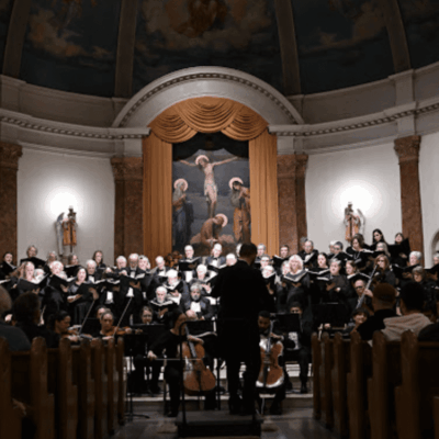 Choir and orchestra performing in church.