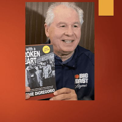 Author holding his book, *With a Broken Heart*.