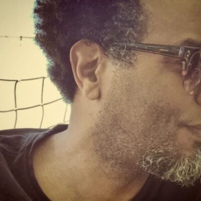 Man with glasses and graying hair.