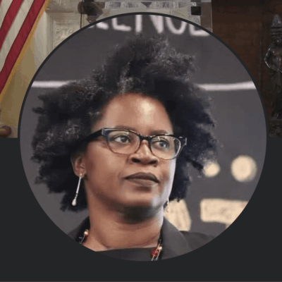Headshot of Black woman in glasses