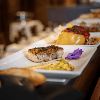 Grilled fish with corn salsa garnish.