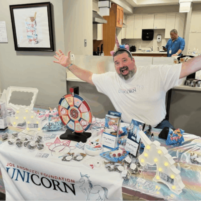 Man at Unicorn Foundation fundraiser.