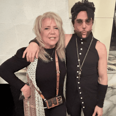 Prince and a woman posing together.