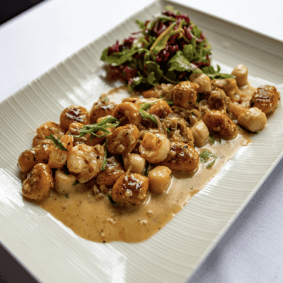 Gnocchi with scallops and creamy sauce.