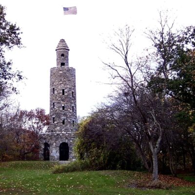 Stone tower with American flag.