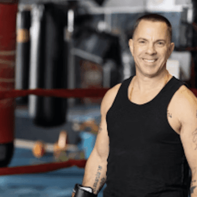 Smiling boxer in a gym.
