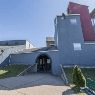 Modern building with arched entrance.