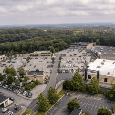 Aerial view of shopping center parking lot.