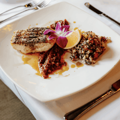 Grilled fish with relish and quinoa.