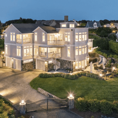 Luxury waterfront home at night.