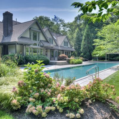 Luxury home with pool and landscaping.