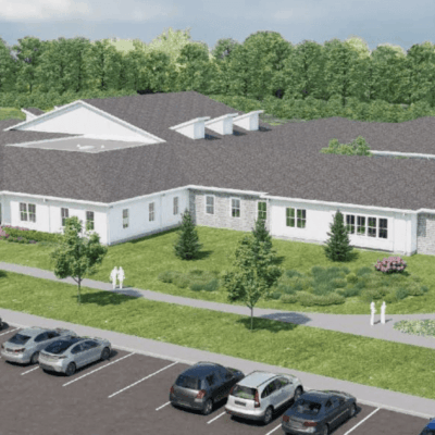 New building with parking and gazebo.