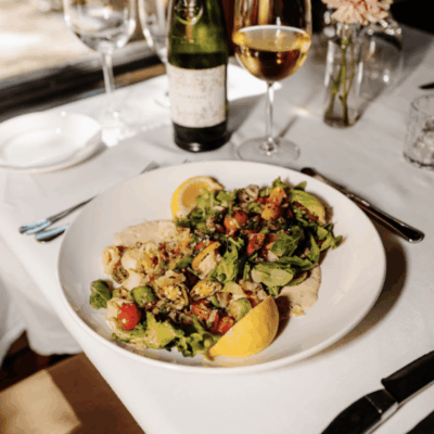 Delicious salad with lemon and wine.