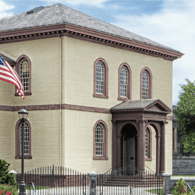 Historic building with American flag.