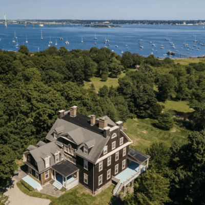 Aerial view of waterfront mansion.