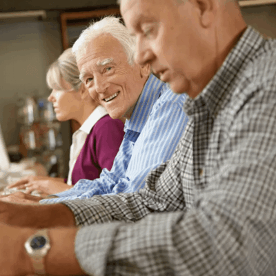 Senior citizens learning computer skills.