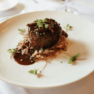 Gourmet beef tenderloin with sauce.