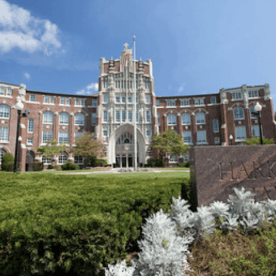 Harkins Hall, brick building, sunny day.