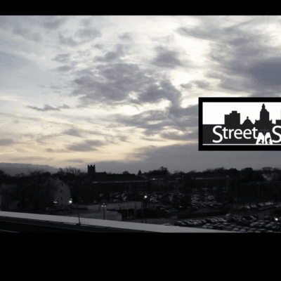 A black and white photo of the street sign.
