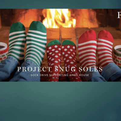 A group of people that are sitting in front of a fireplace.