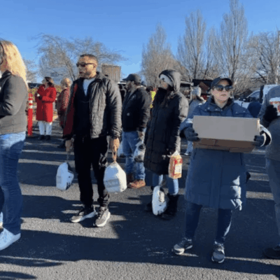 A group of people walking down the street
