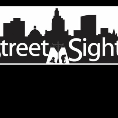 A black and white picture of the street sights logo.